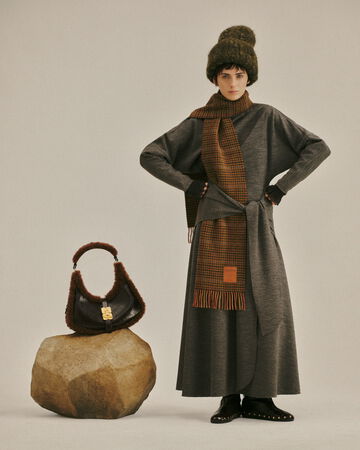 Model wearing a knit dress from the Fall/Winter 2026 collection
