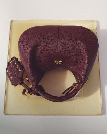 GANNI Mini Hobo Bag on table